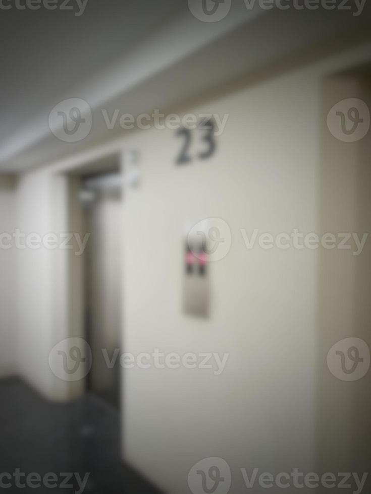 Defocused blurred photo of elevator corridor on floor 23 in a high rise building.