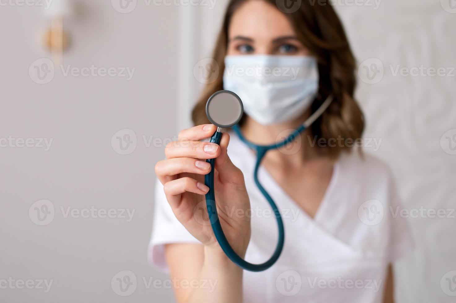 Cute girl doctor shows a stethoscope photo