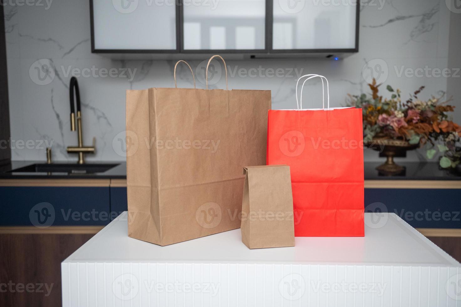 Craft shopping bags are on the kitchen table photo