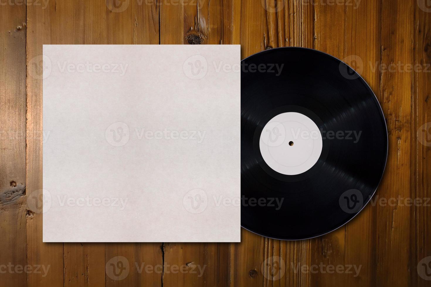 Vinyl record mockup with copy space on a wooden desk photo