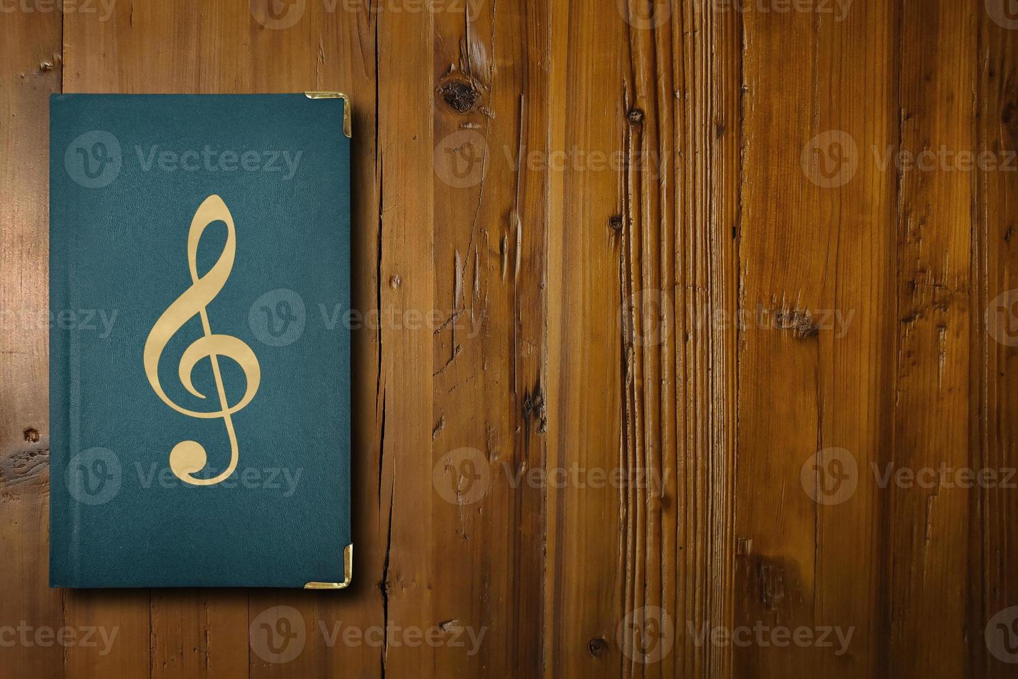 Music book on a wooden desk photo