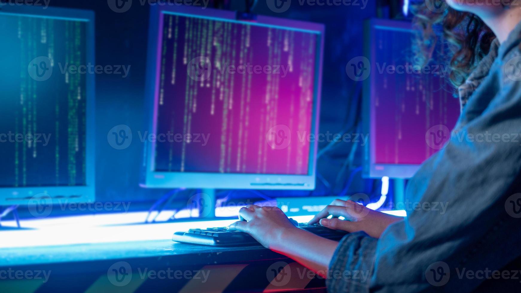 an asian woman programmer is working in her computer room , futuristic technology concept photo