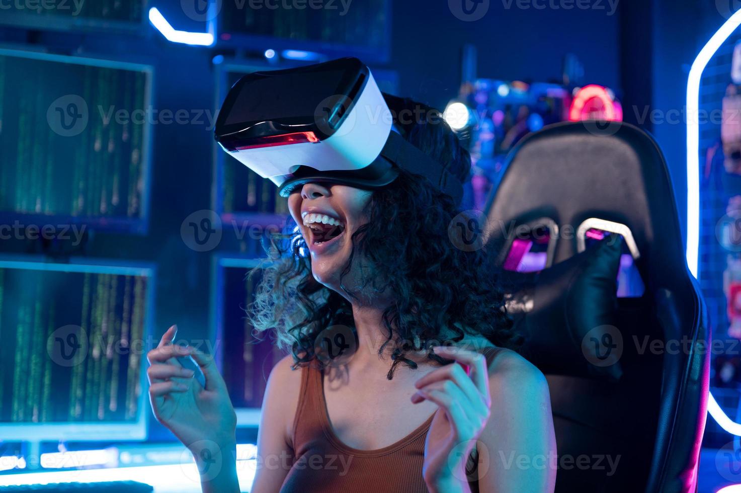 A young Asian woman using virtual reality  , vr box to play online game or watch movie photo