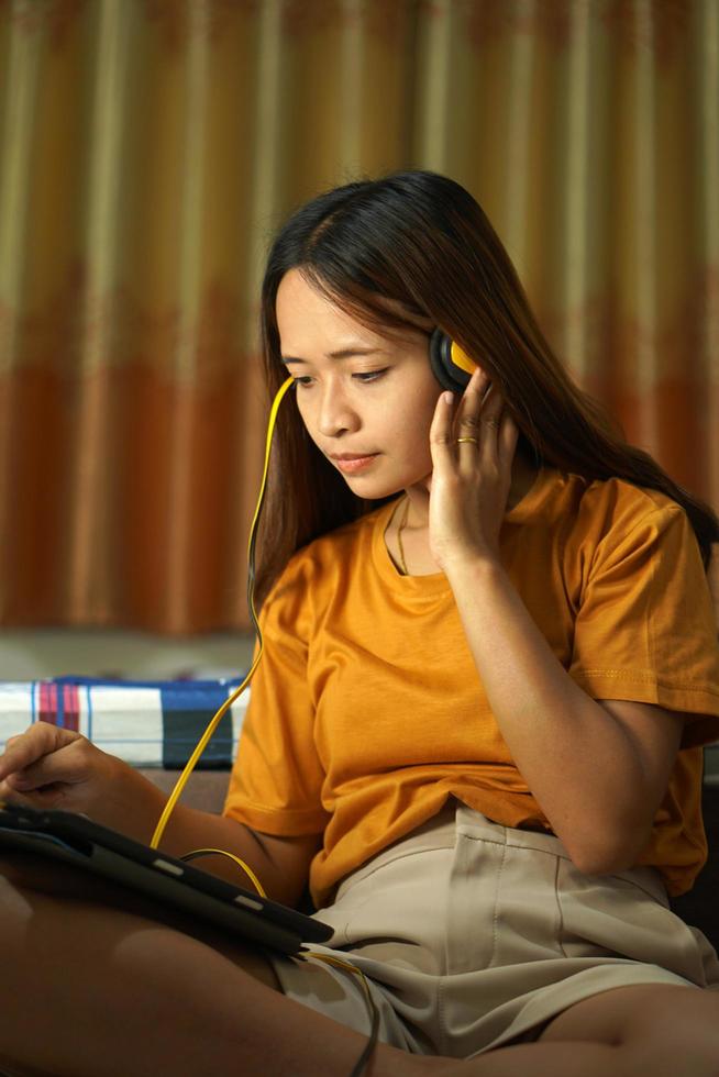 happy asian woman from listening to music photo