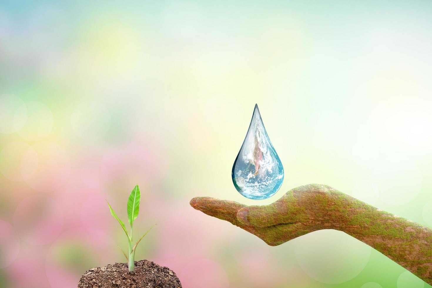 concept of saving the world water droplets on human hands photo