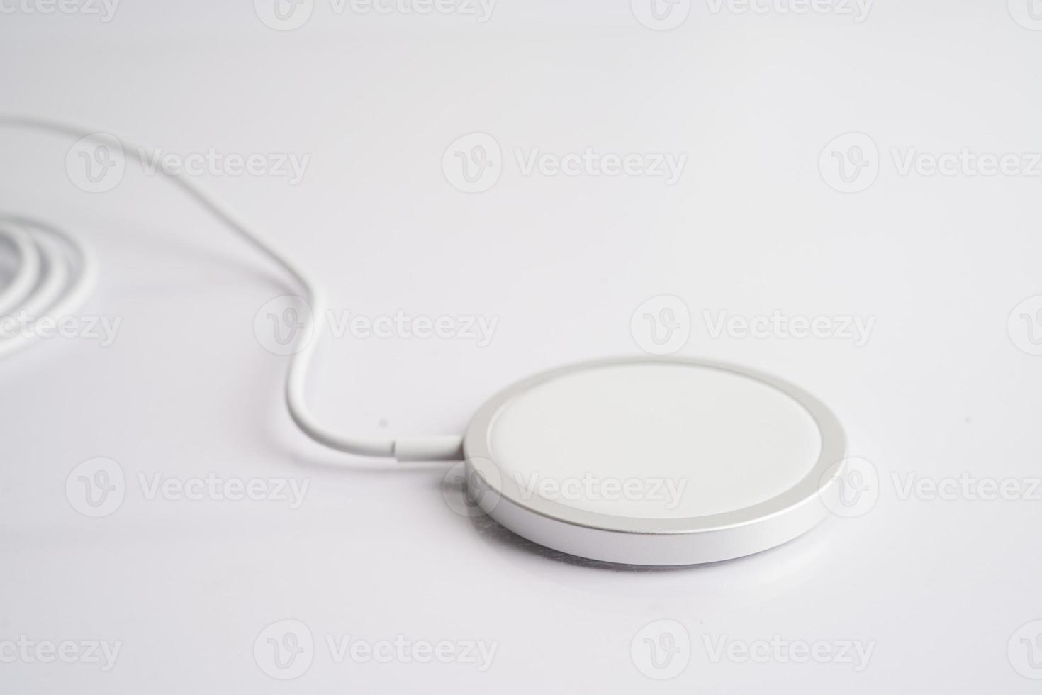 Wireless charger, magnetic charging modern equipment of mobile phone. photo