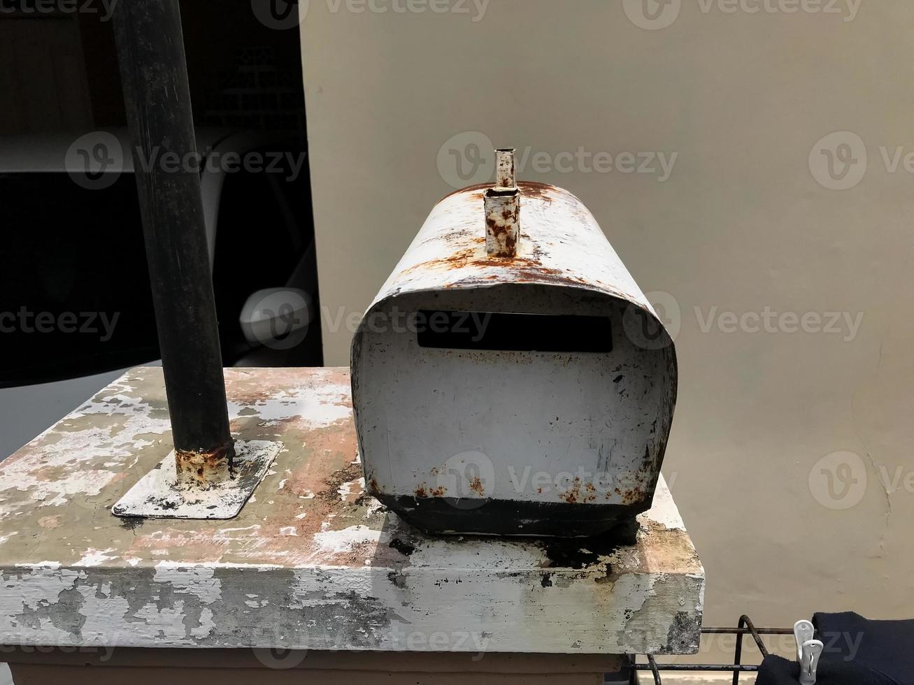 A mailbox that is old and has a lot of rust photo