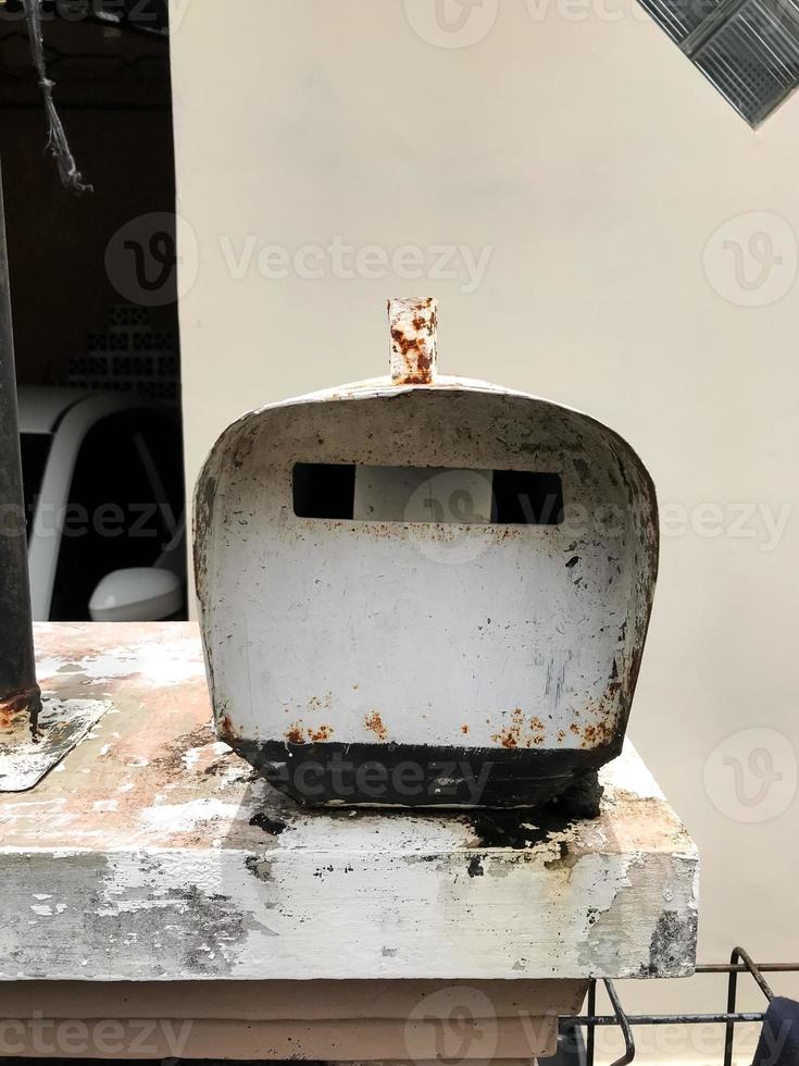 A mailbox that is old and has a lot of rust photo