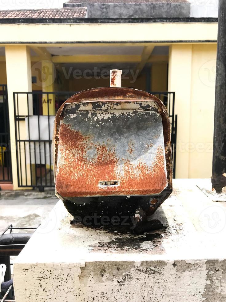 A mailbox that is old and has a lot of rust photo
