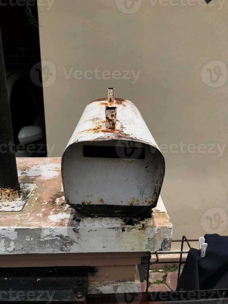 A mailbox that is old and has a lot of rust photo