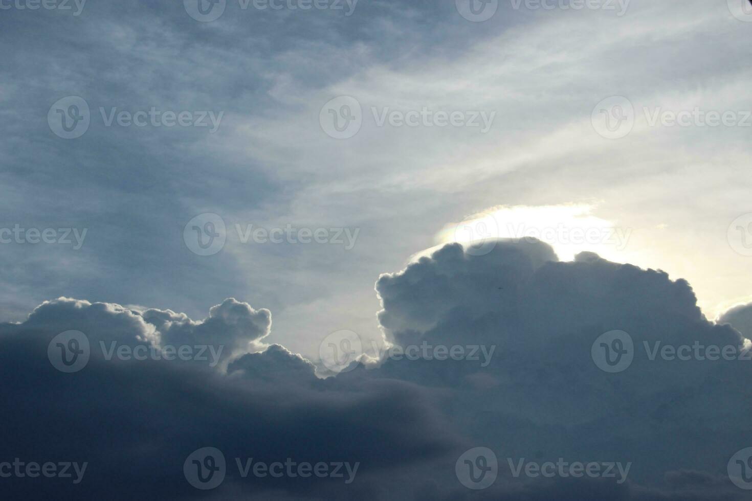 dark blue cloud with white light sky and sun ray with rainbow color reflection background photo