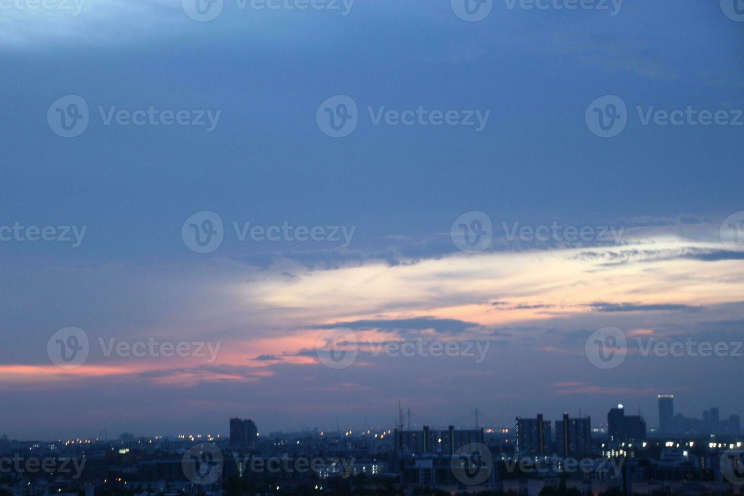 dark blue cloud with white light sunset sky background and city light midnight evening time photo