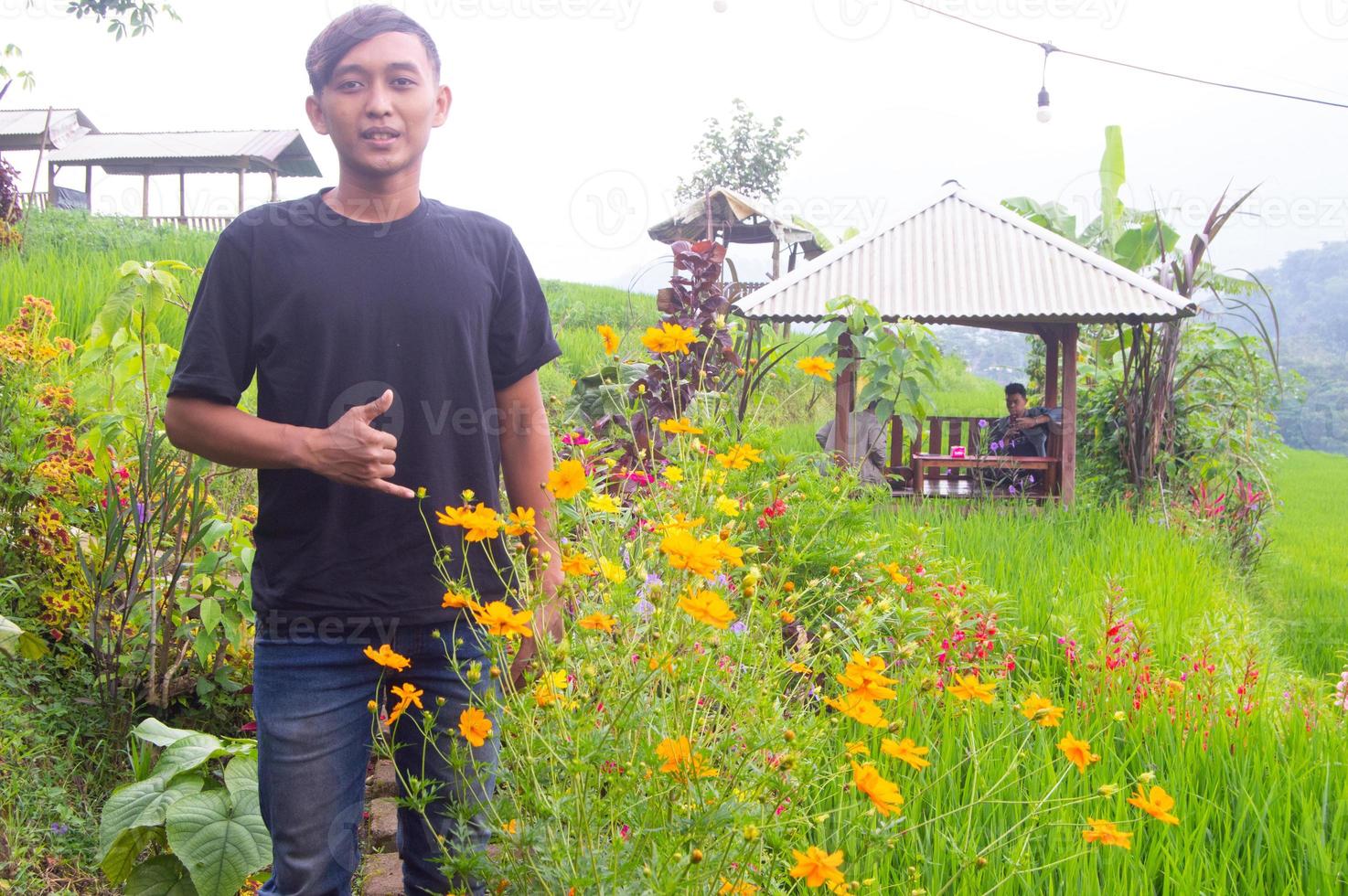 a man dressed in plain black at the trawas park in mojokerto photo