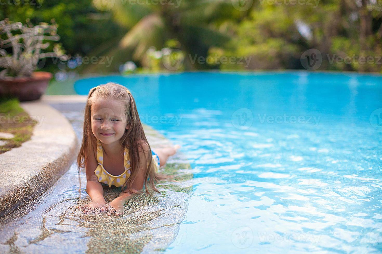 Beautiful little girl on the beach photo