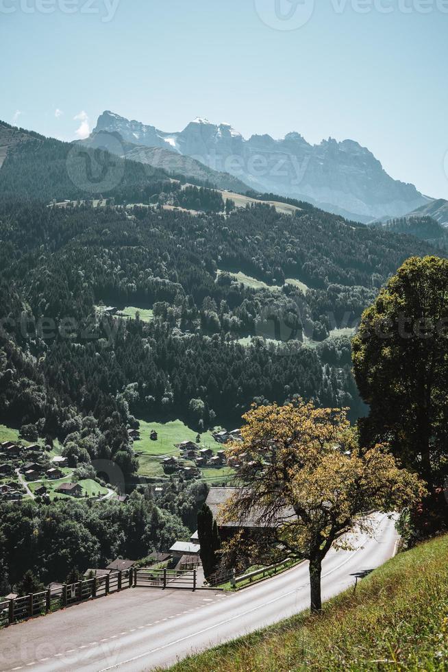 Wooden hut in the alps with mountains in the background Panorama photo