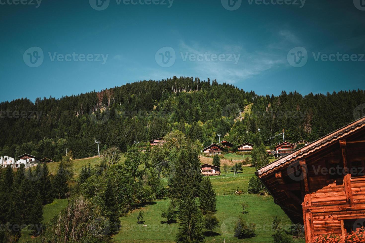 Wooden hut in the alps with mountains in the background Panorama photo