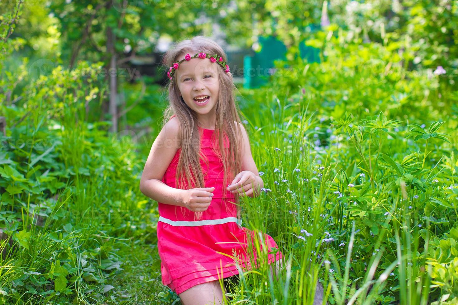 Little girl on the park outdoors photo