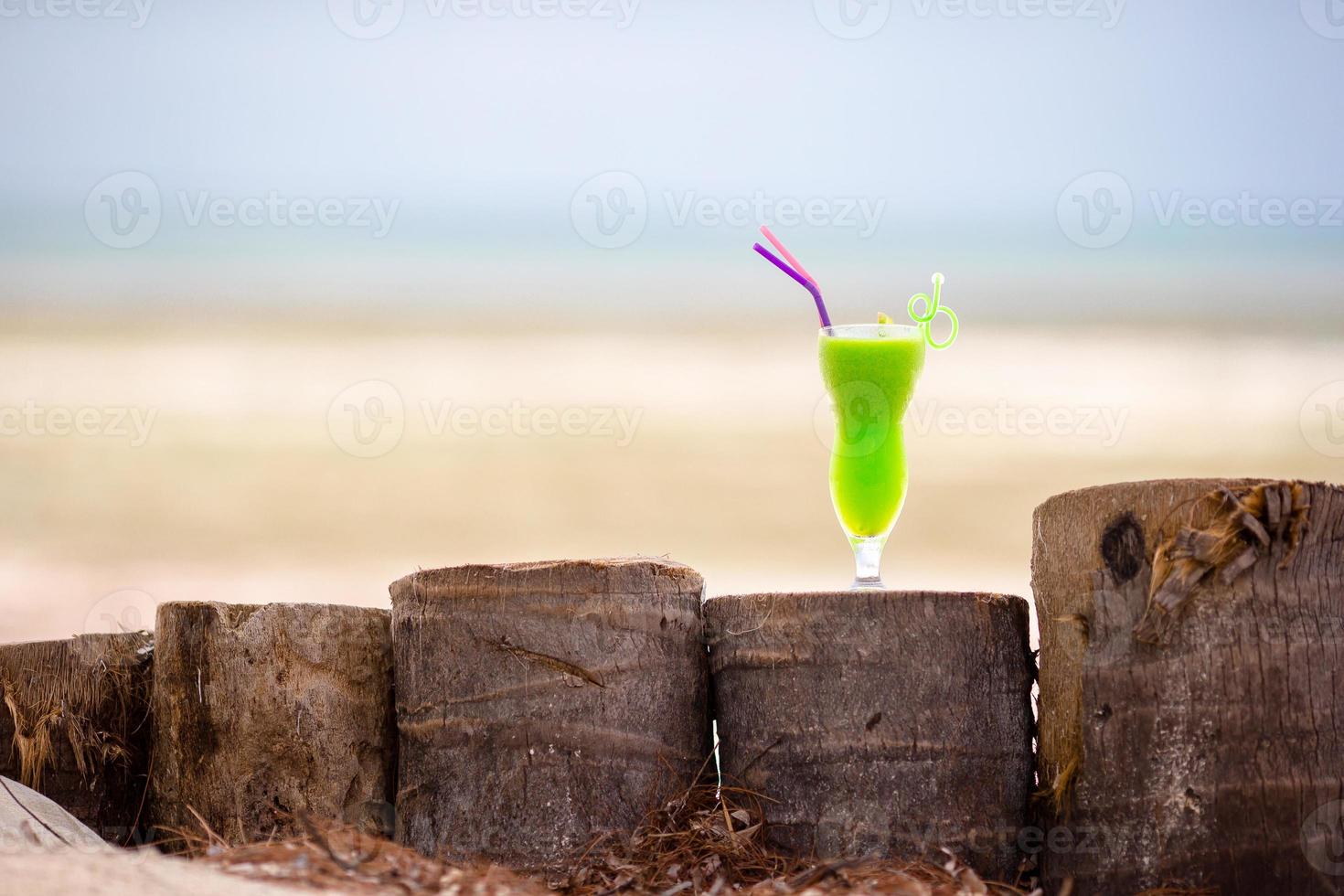 Green drink by the beach photo