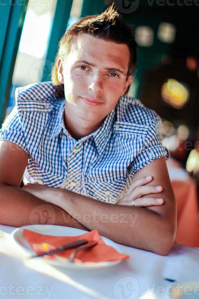 Young man on the table photo