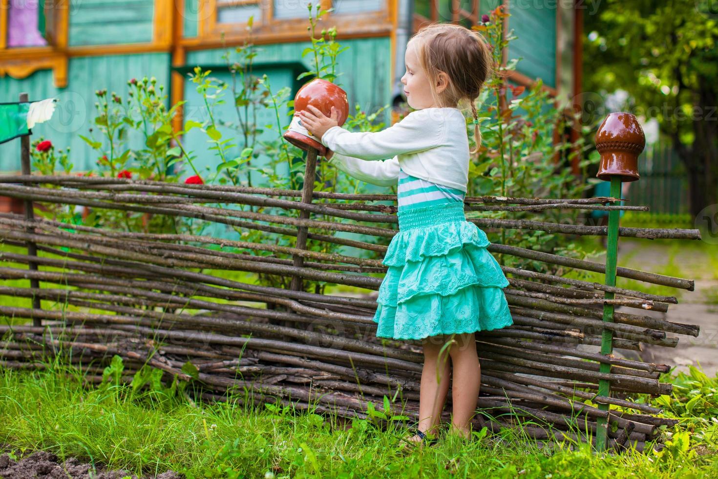 Little girl on the garden photo