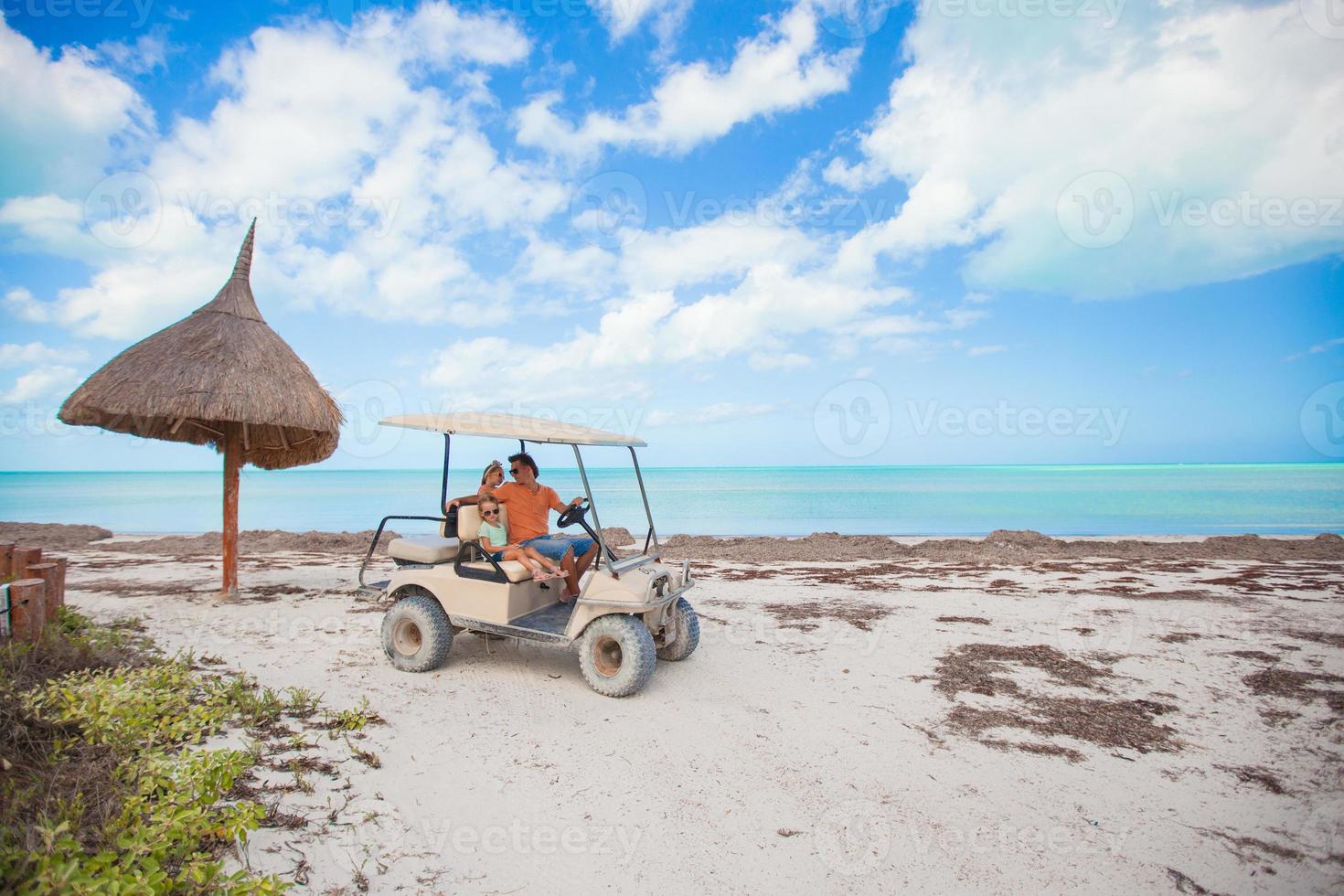 Family on the beach car photo