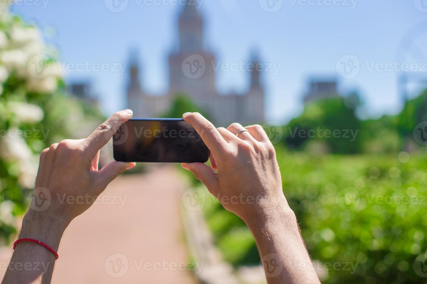 Hands holding a phone photo