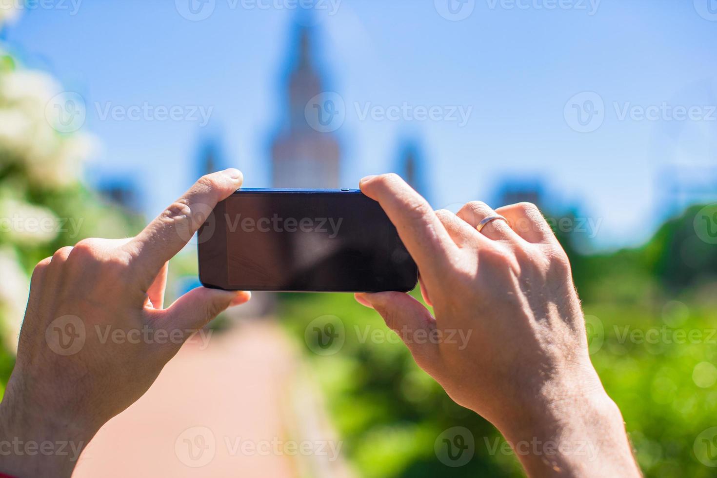 Hands holding a phone photo