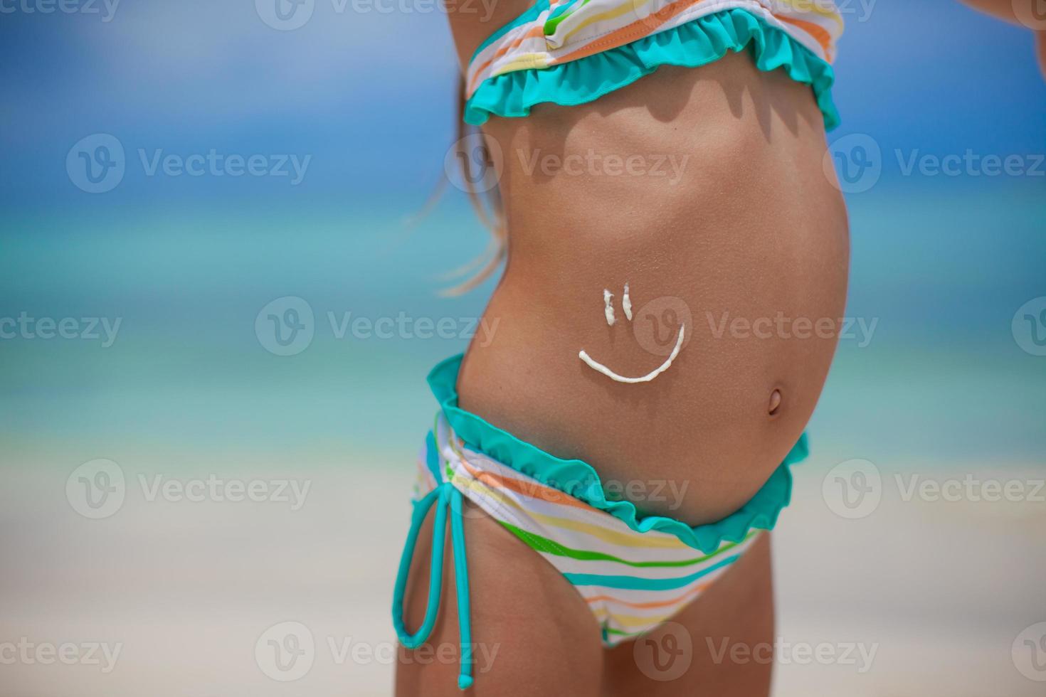 Little girl having fun on the beach photo