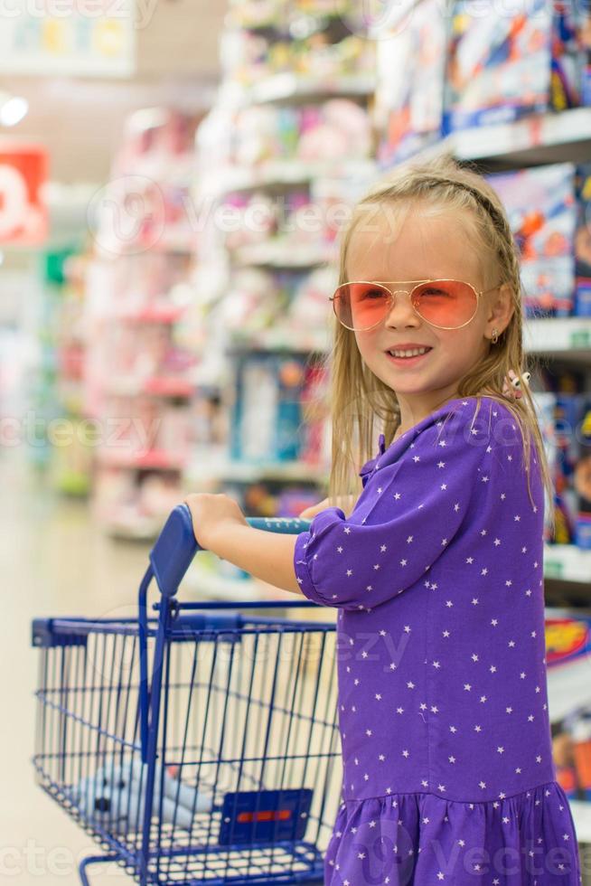 Little girl on the super market photo