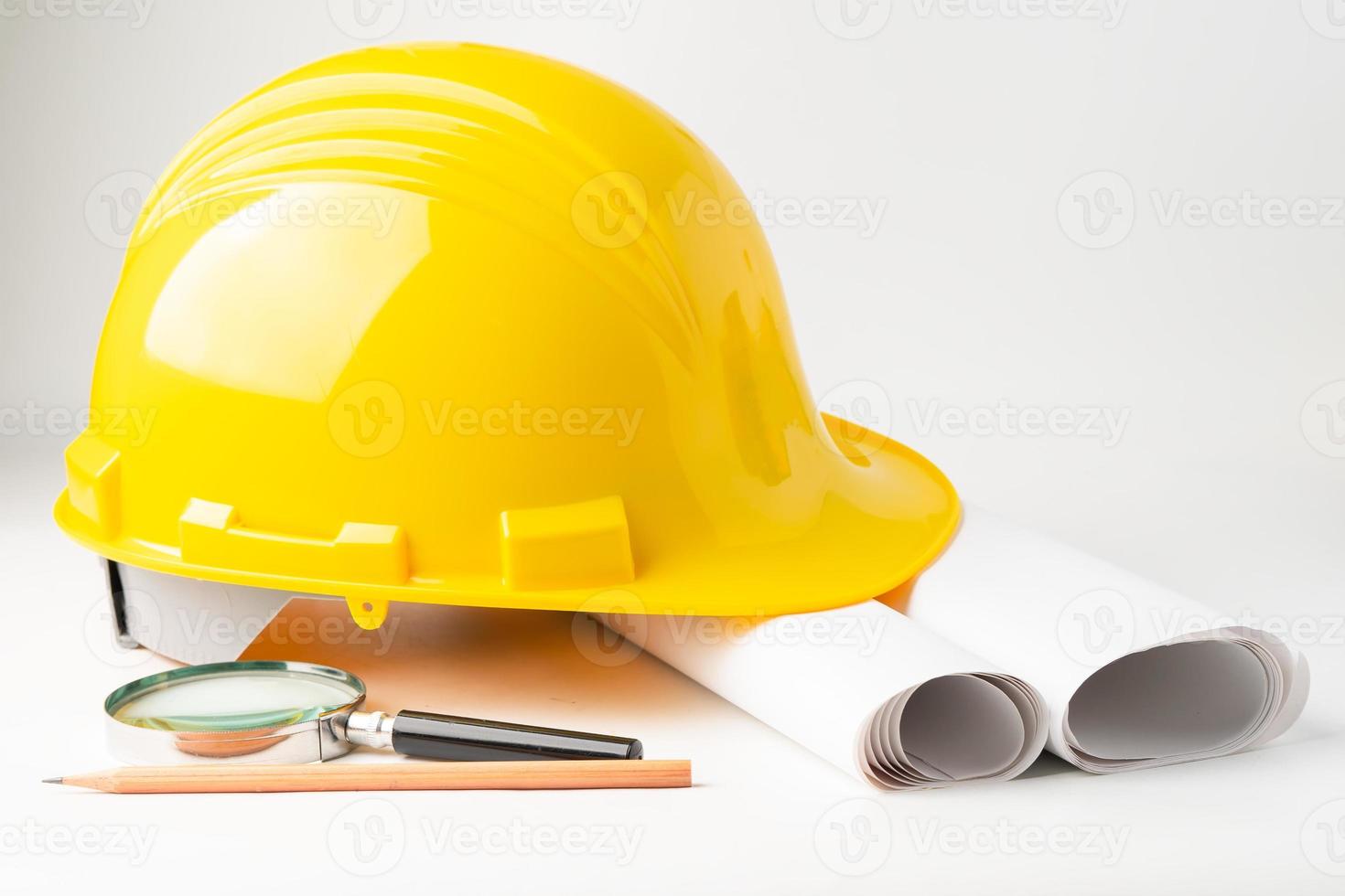 Architectural house plan project blueprint and yellow helmet with calculator, engineer construction tools. photo