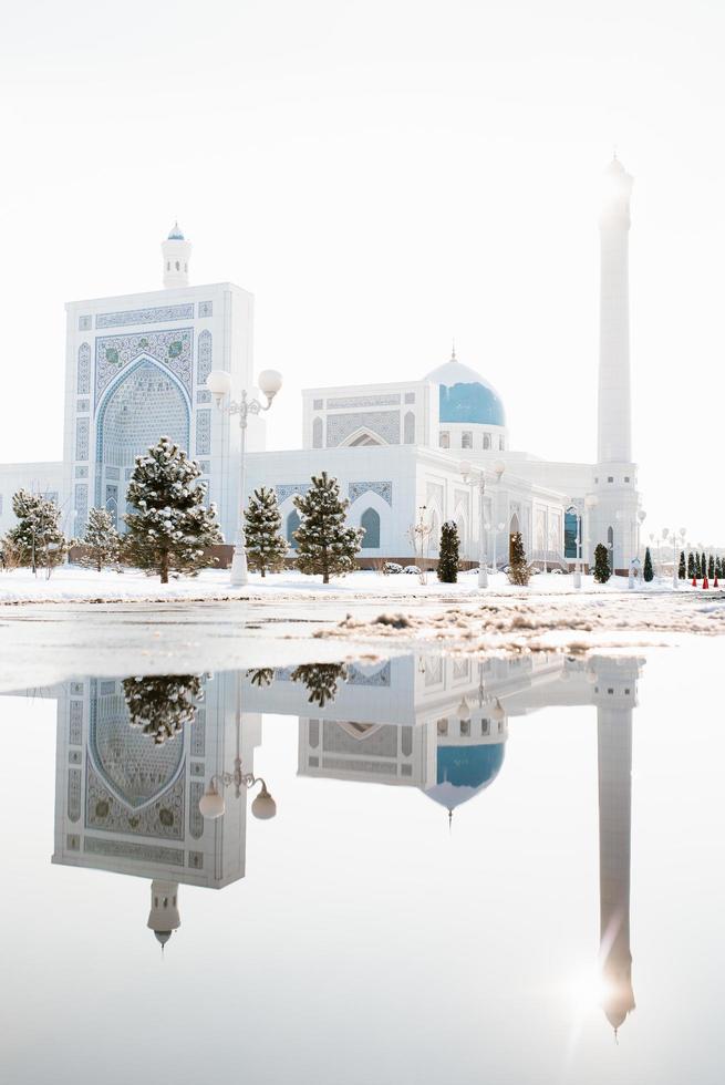 Tashkent, Uzbekistan. December 2020. White Mosque Minor in winter on a sunny day photo