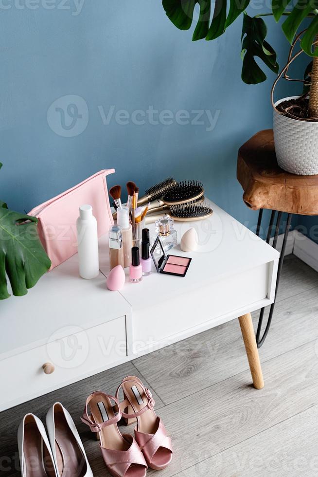 Stylish room interior with elegant dressing table and plants photo