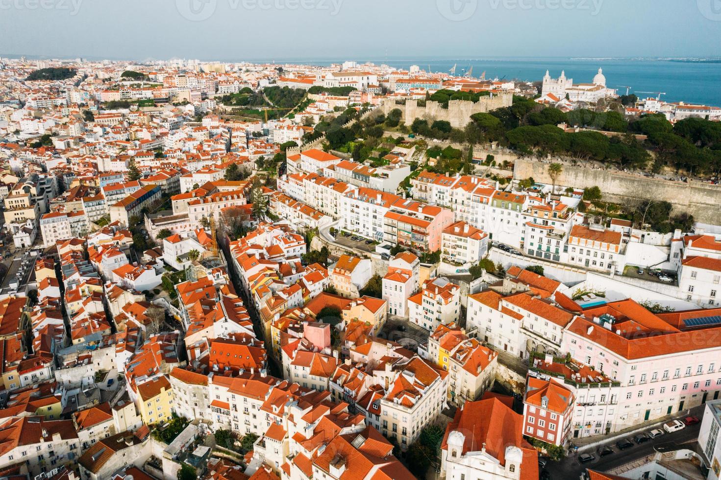 Aerial drone view of St. George Castle in Lisbon, Portugal with surrounding cityscape photo