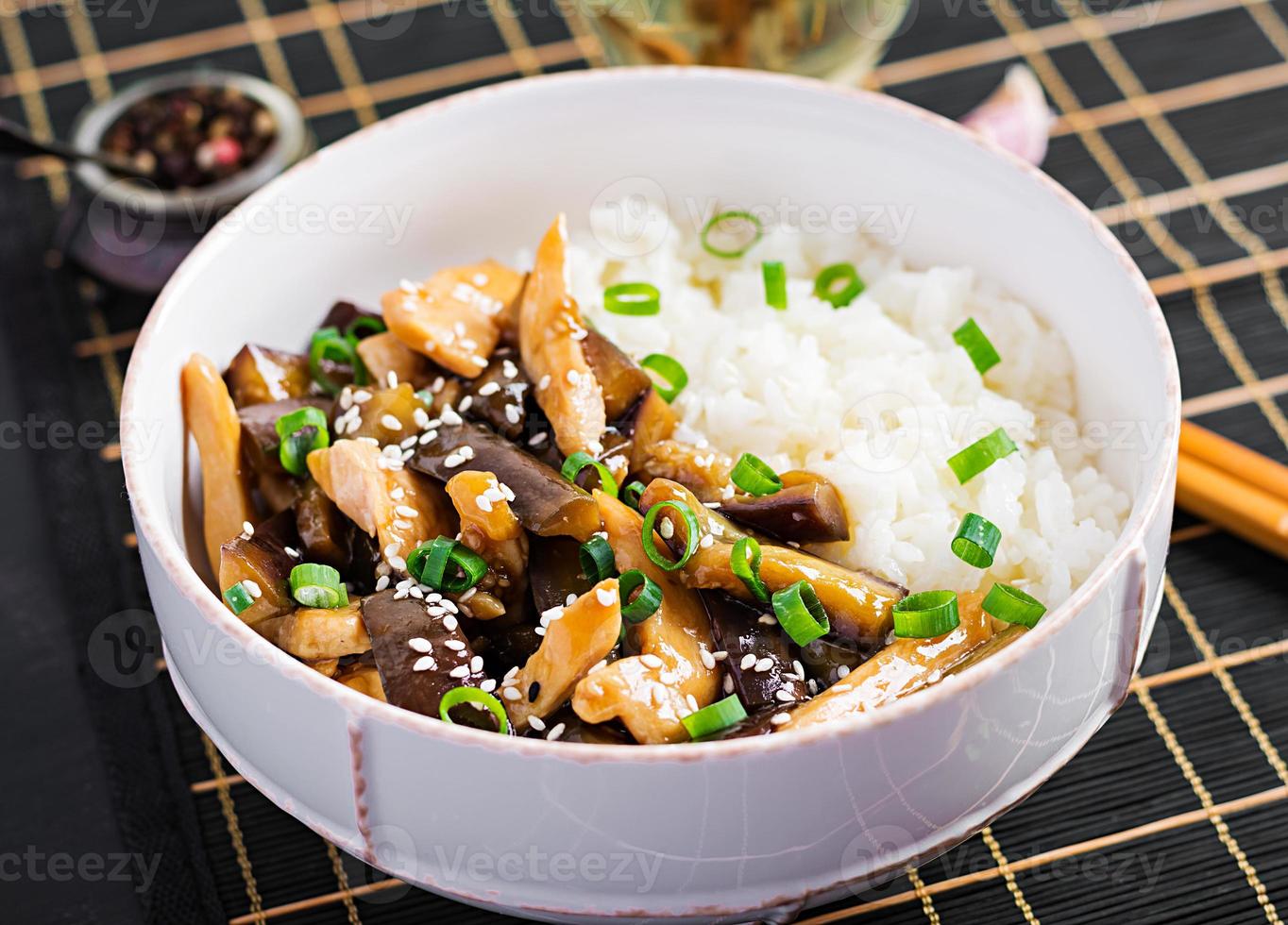 Stir fry with chicken, eggplant and boiled rice - Chinese food photo