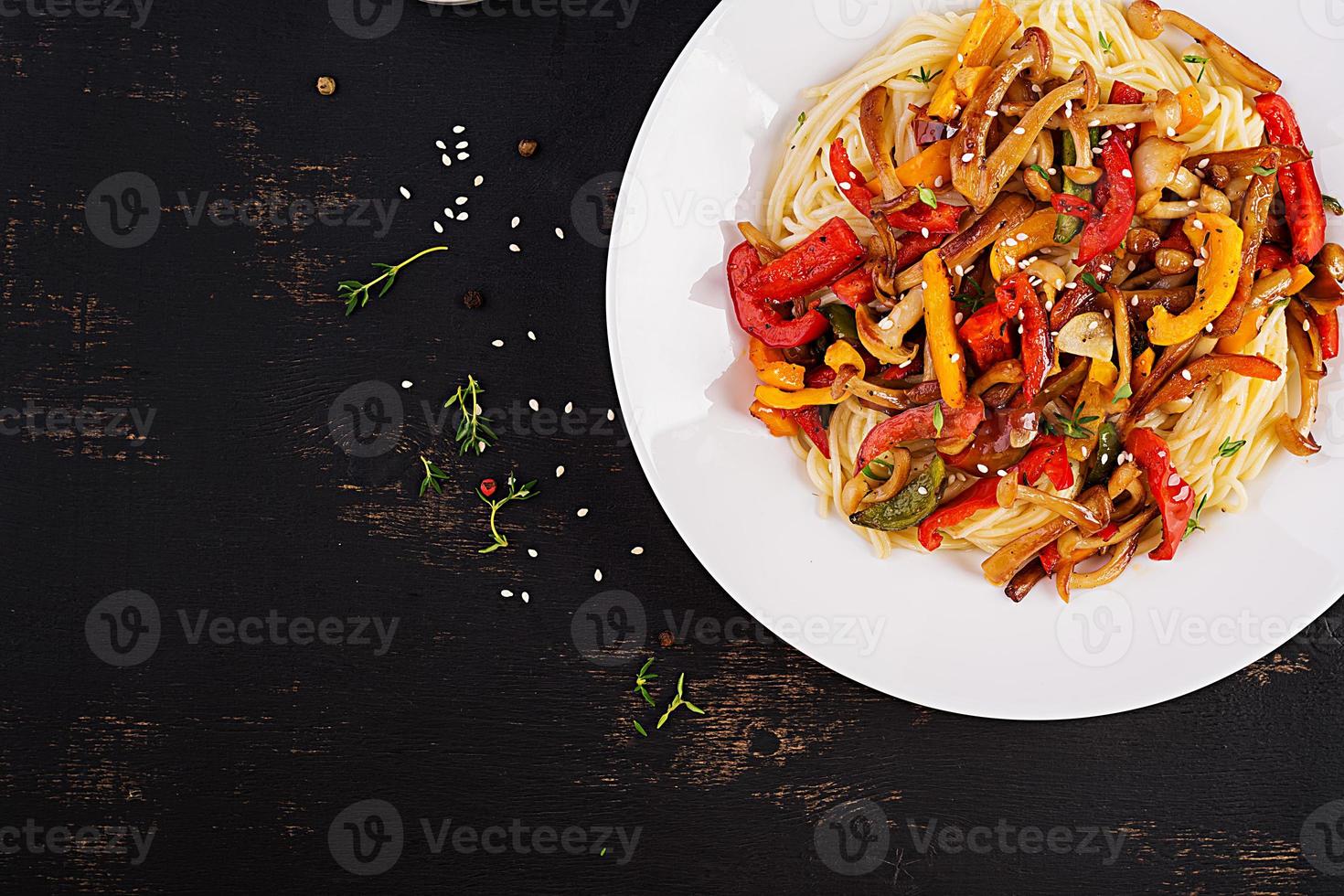 Noodles with shimeji mushrooms and paprika. Oriental meal. Japanese