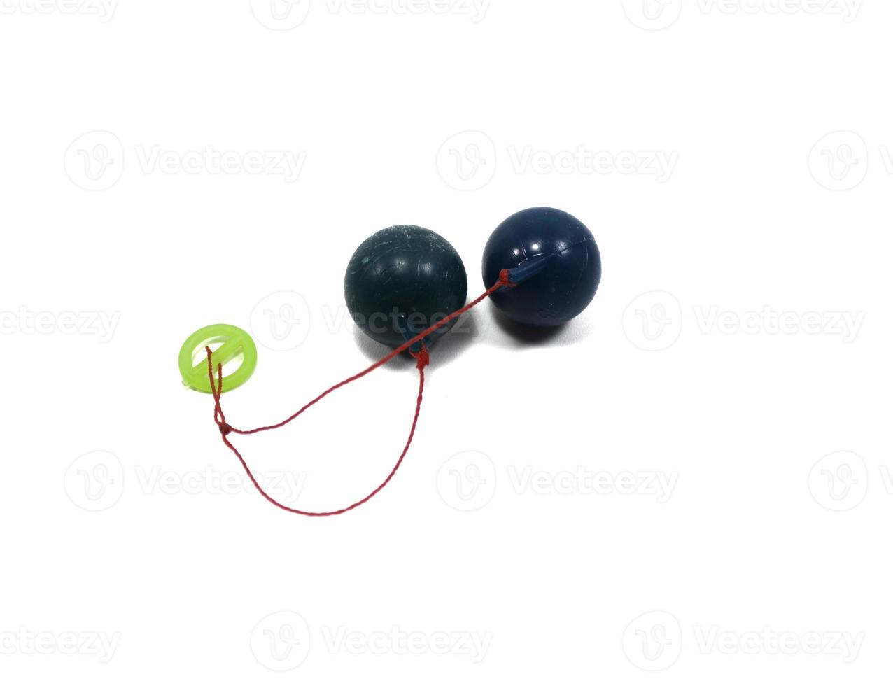 lato-Lato. A traditional toy consisting of two heavy pendulums made of plastic and suspended by a string. Its traditional game can be found in Indonesia. photo