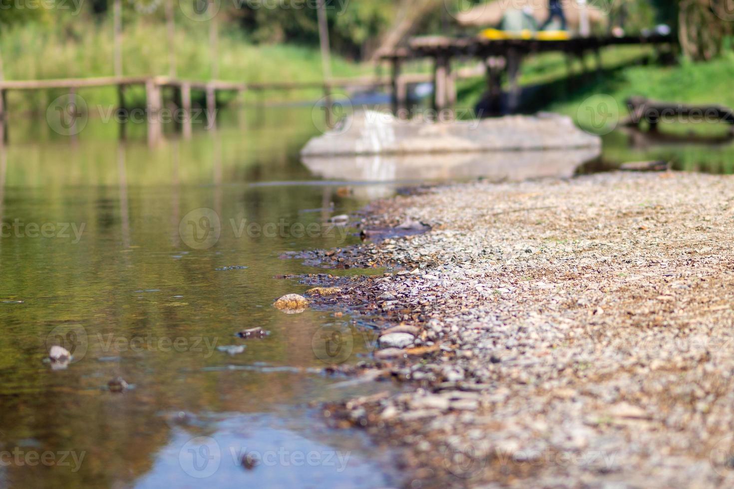 Stone and river at Utaradit, Thailand. photo