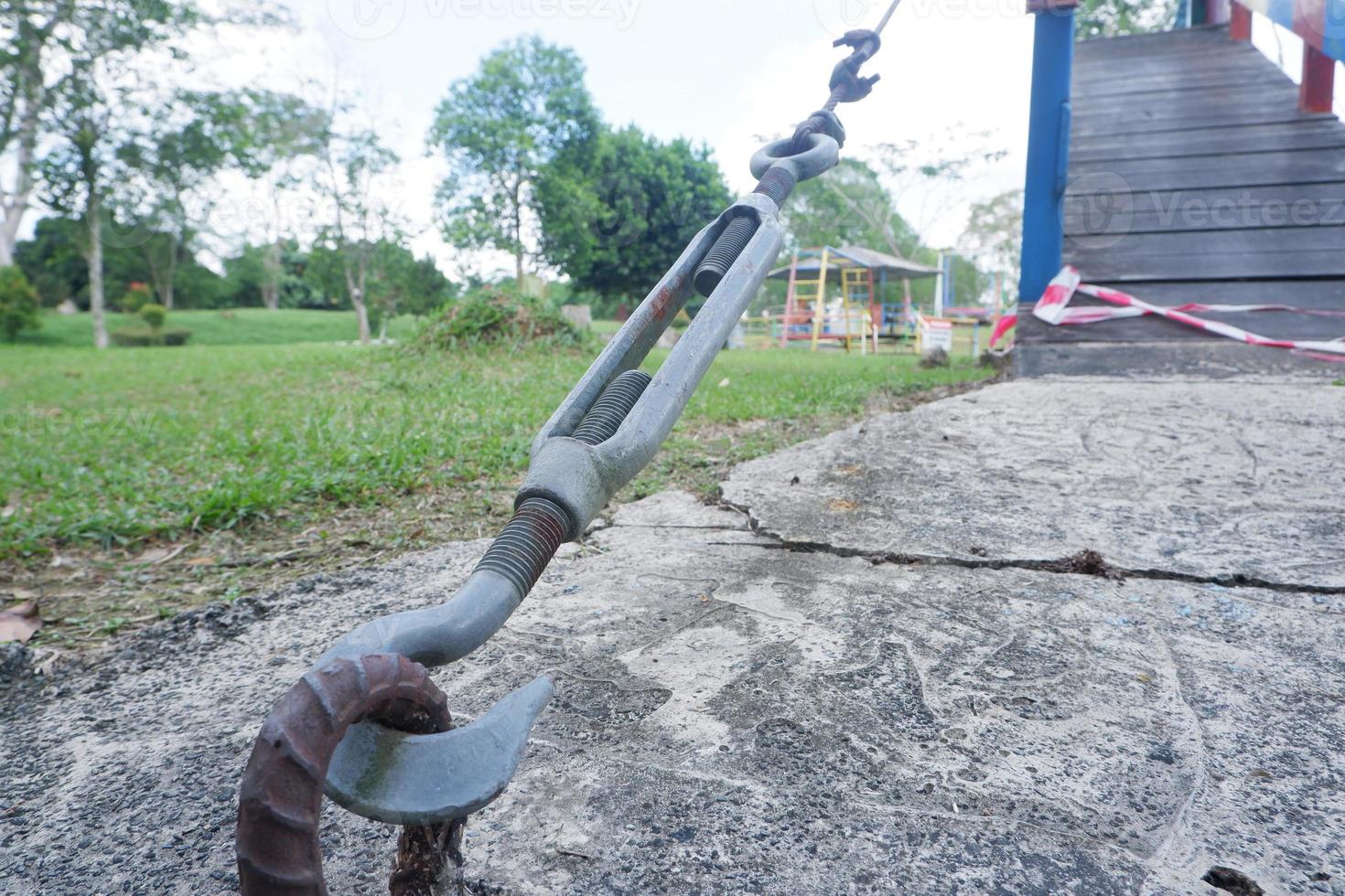 selective focus on metal lanyards and hooks used to pull and strengthen wire slings that hold up bridges or building construction photo