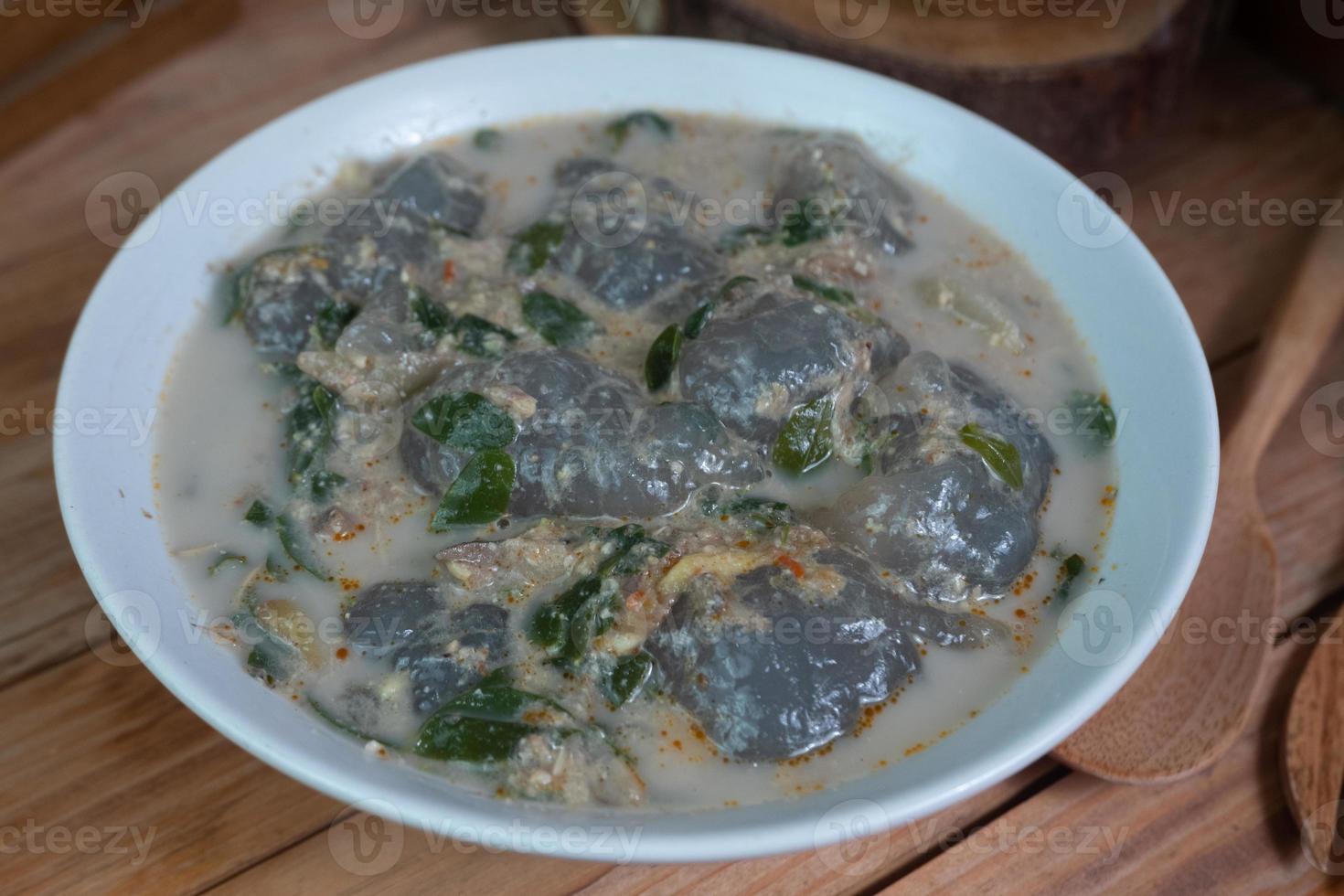selective focus on food kapurung is a soup with a slightly sour and fresh taste originating from Sulawesi, this food is made from sago flour or starch with fish water broth, soft focus photo