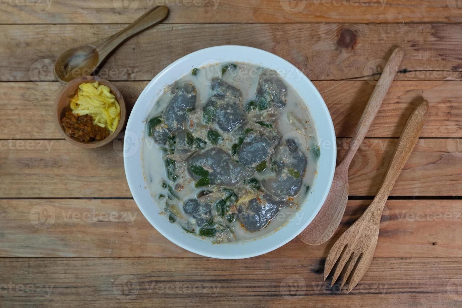 selective focus on food kapurung is a soup with a slightly sour and fresh taste originating from Sulawesi, this food is made from sago flour or starch with fish water broth, soft focus photo