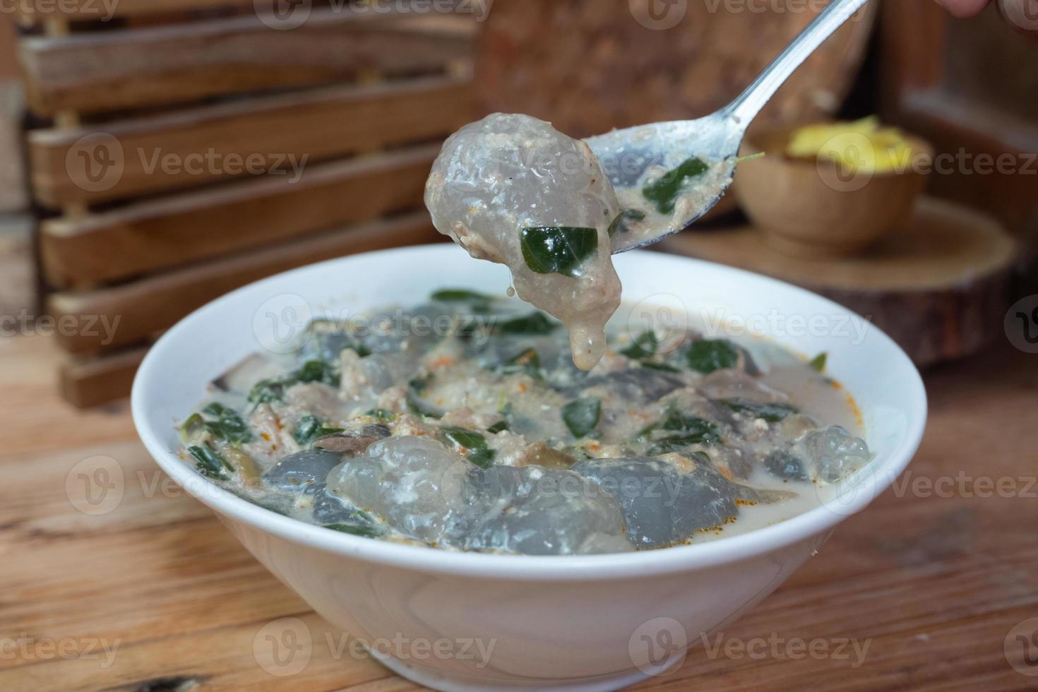 selective focus on food kapurung is a soup with a slightly sour and fresh taste originating from Sulawesi, this food is made from sago flour or starch with fish water broth, soft focus photo
