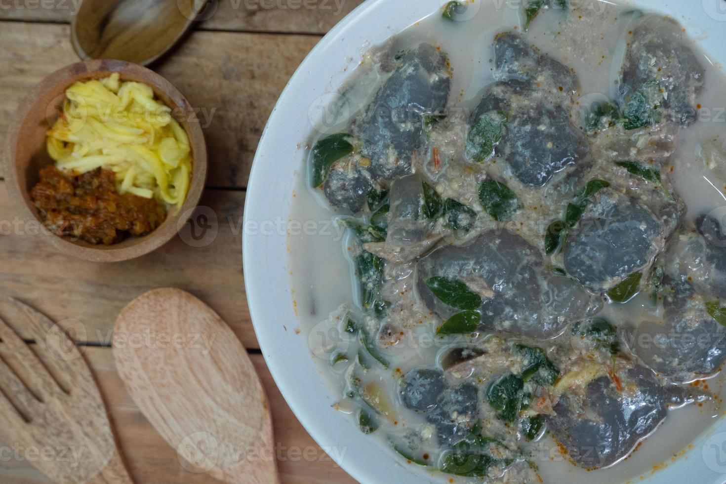 selective focus on food kapurung is a soup with a slightly sour and fresh taste originating from Sulawesi, this food is made from sago flour or starch with fish water broth, soft focus photo