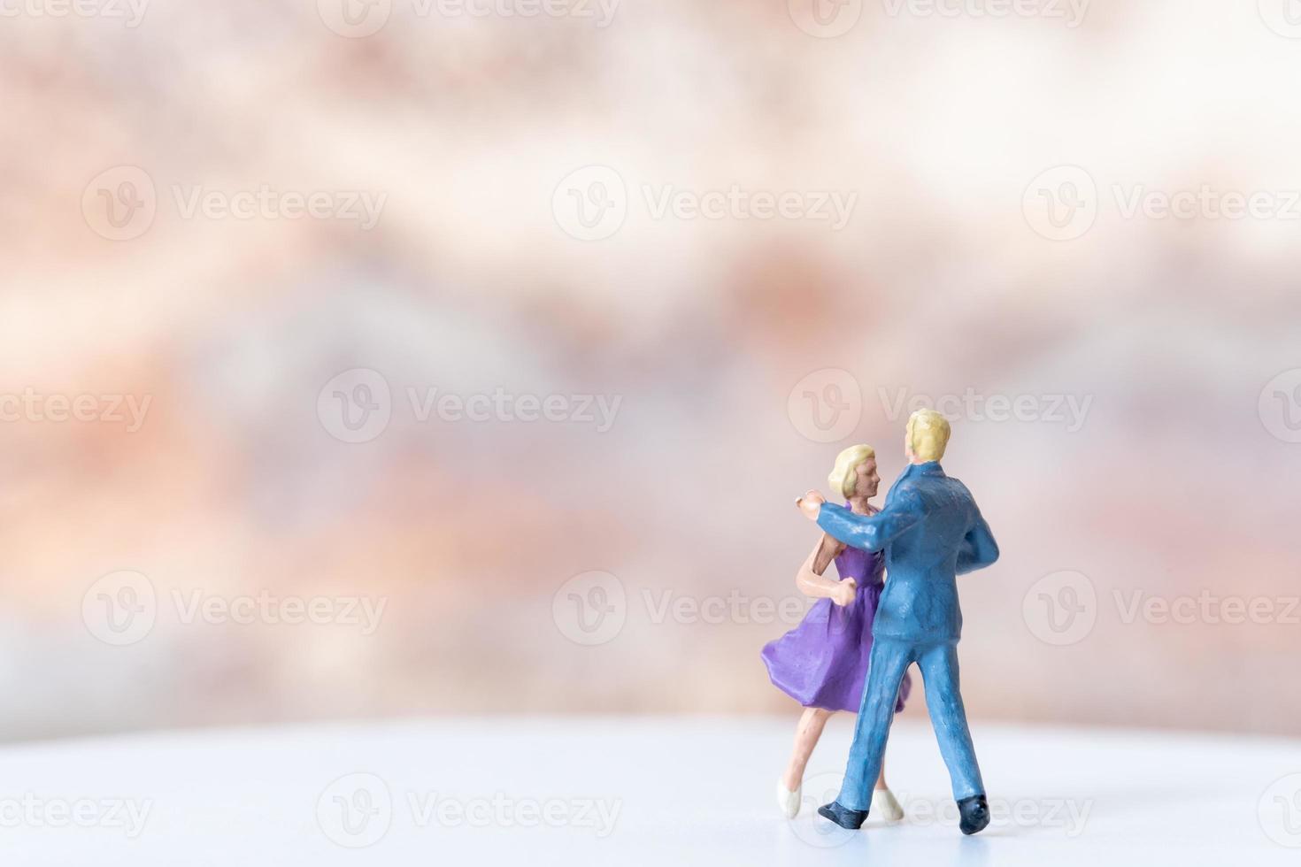 Miniature Couple dancing on dance floor , International dance day concept photo