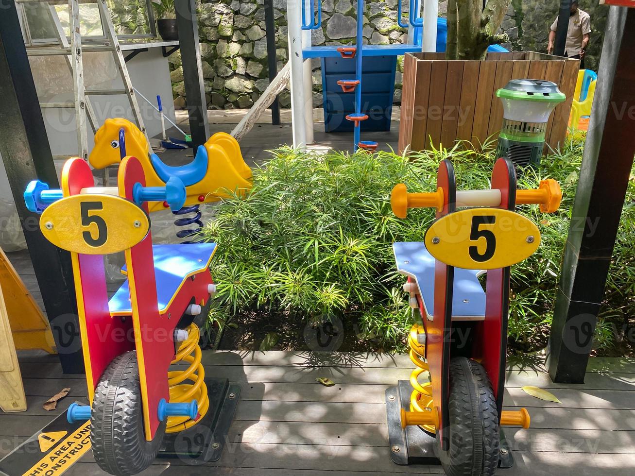 Colorful playground made of plastic empty outdoor playground set playground equipment.Garden equipment. Children's slide. School yard. Playground in the park. photo