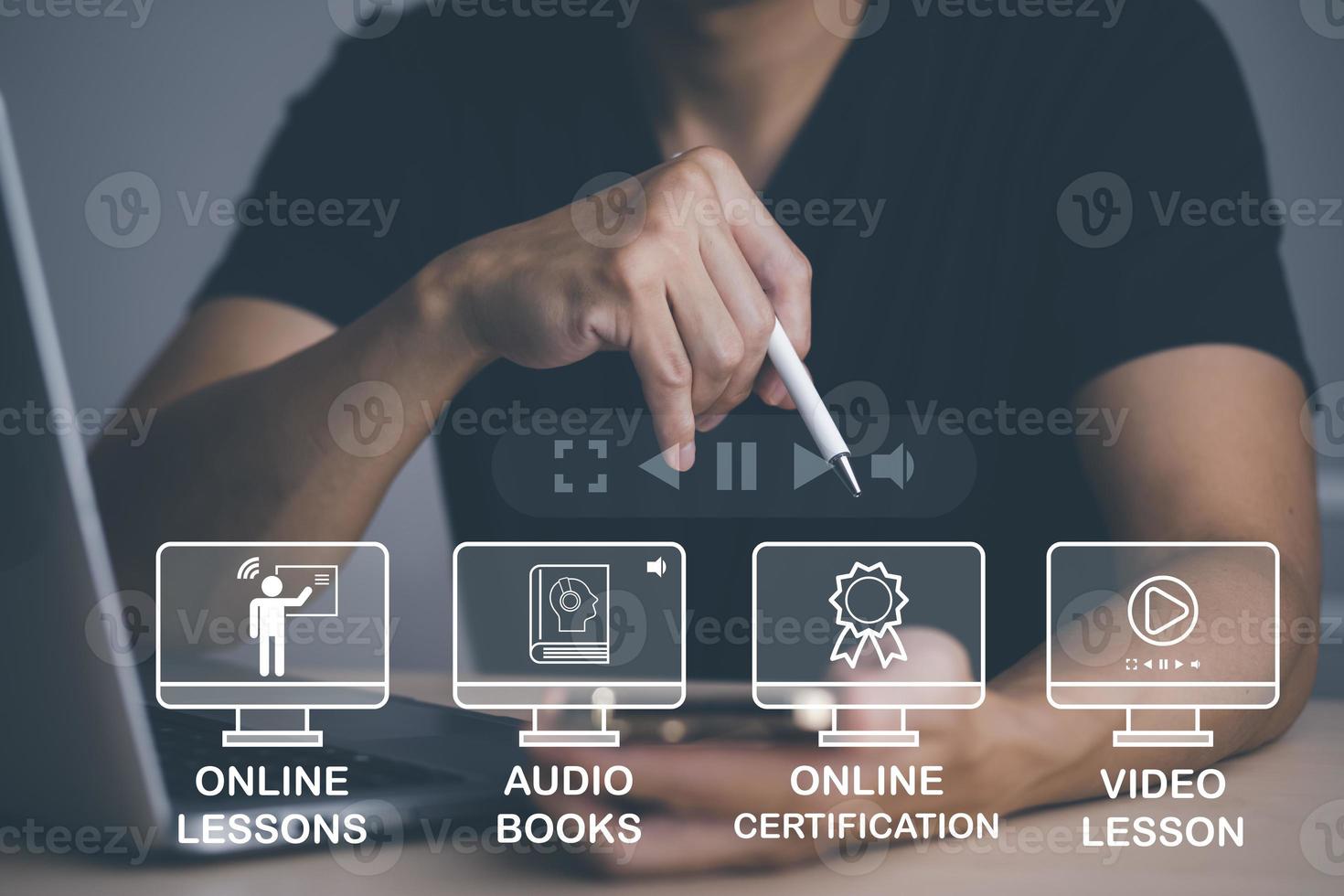 Concept E-learning education,Man using laptop with Online Education icon on virtual screen. video internet lessons and online webinar, online lessons on a digital screen.Education internet Technology. photo