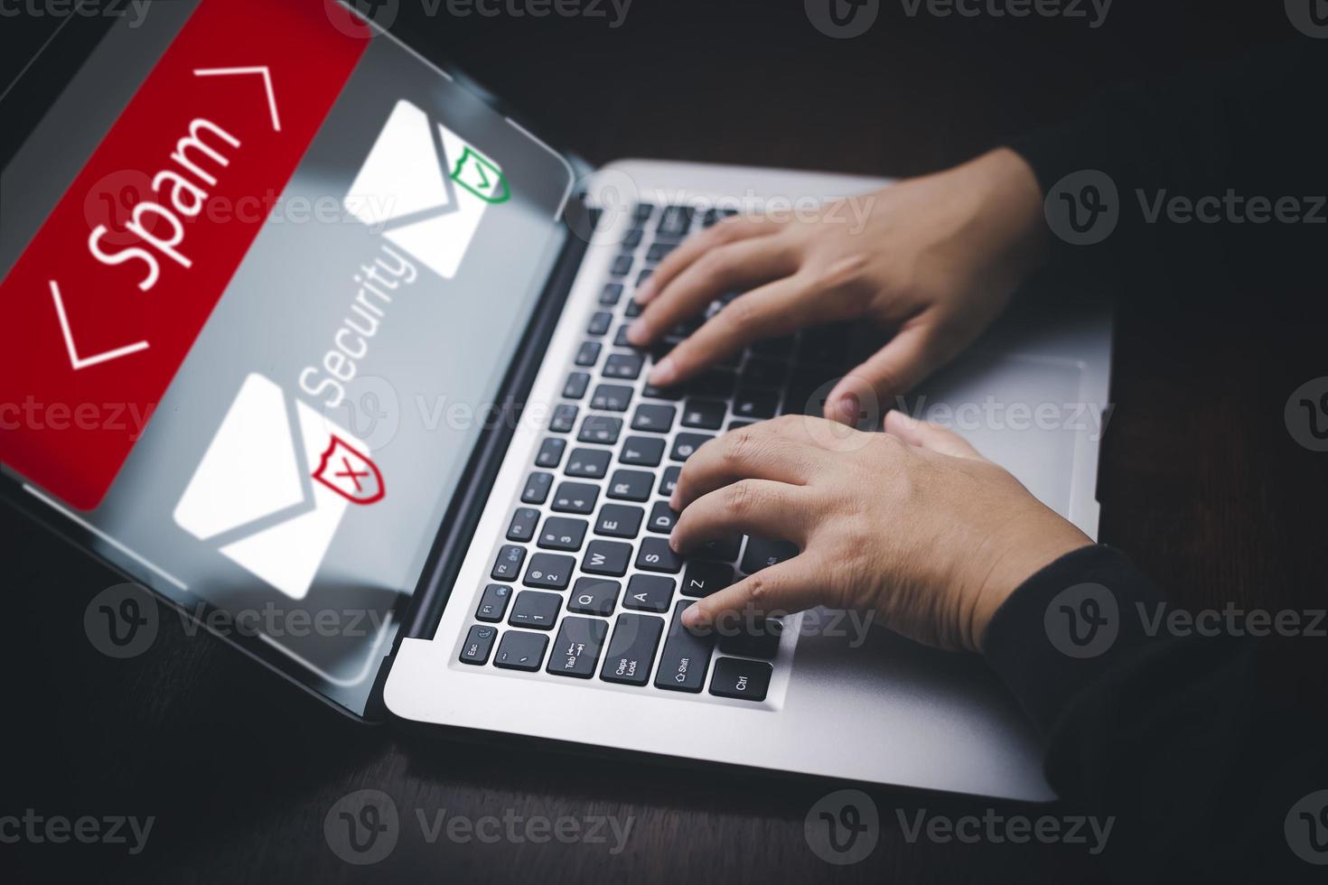 Email concept with laptop spam and virus computer monitor internet security concept, businessman reading electronic mail with a laptop. Spam, junk and e-marketing on screen, Spam Email Pop-up Warning. photo
