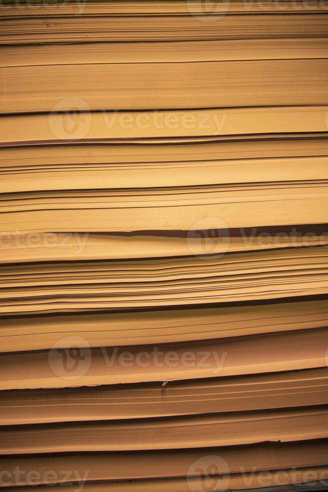 Stack of old books close up. Abstract background and texture for design photo