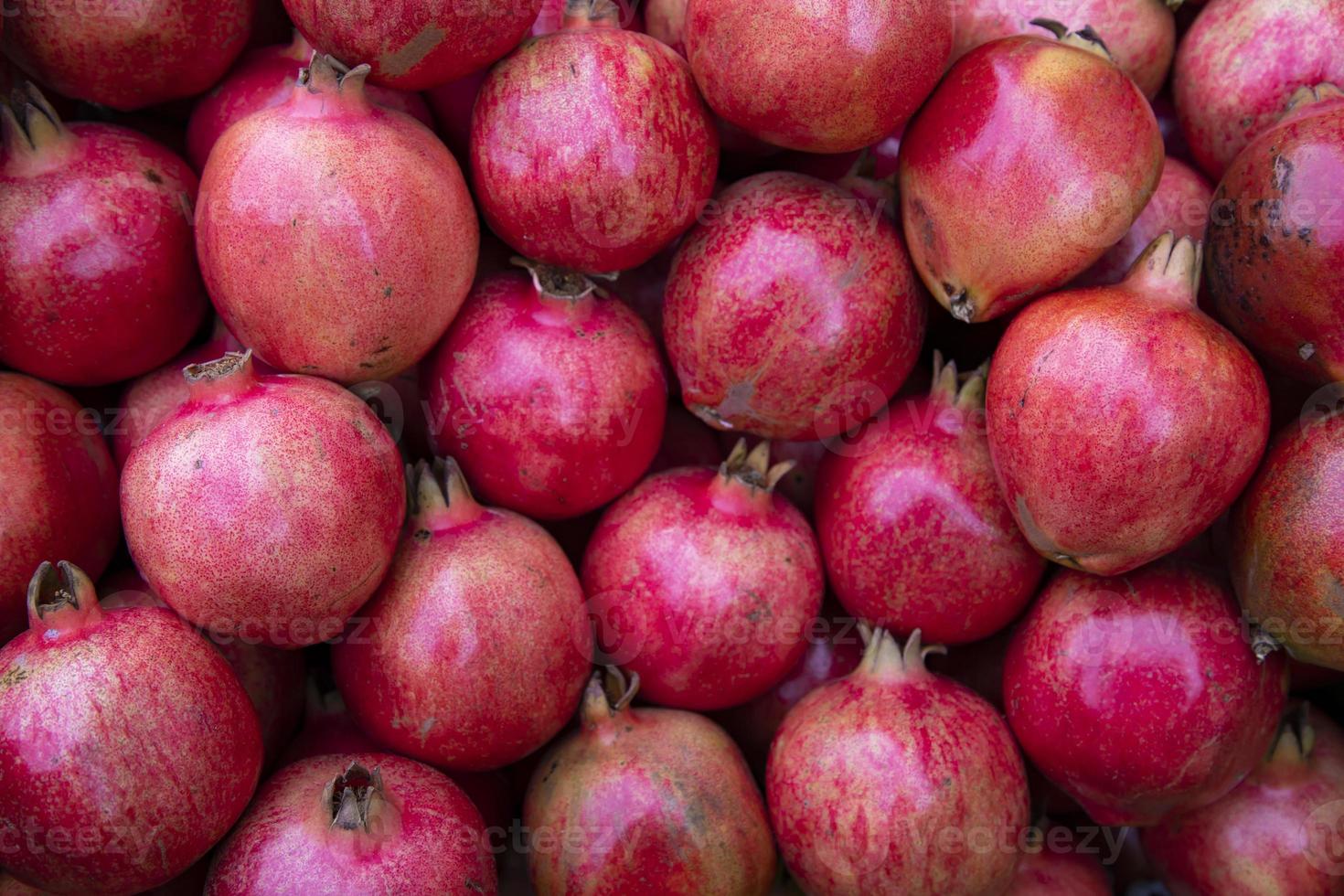 Ripe red Pomegranate fruit in the market. Pomegranate Texture background photo