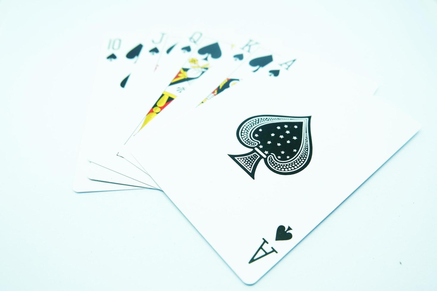 Royal Flush of Spade ,All the same suit, sequence A-K-Q-J-T in white background photo