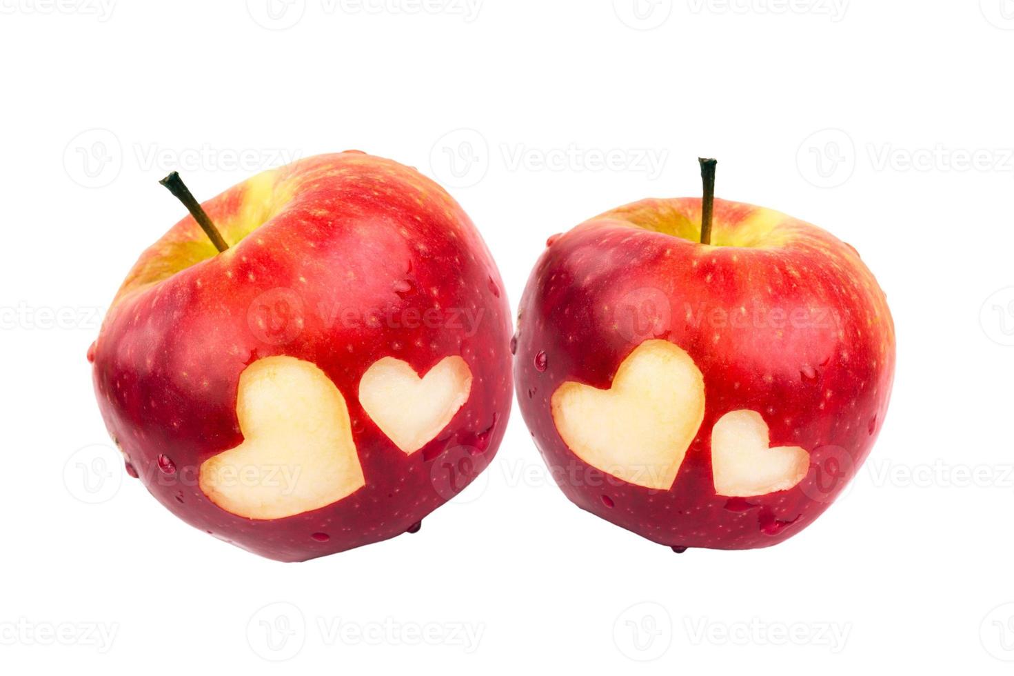 Two apples with hearts on a white background photo